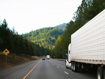 Photo of tractor trailer on highway